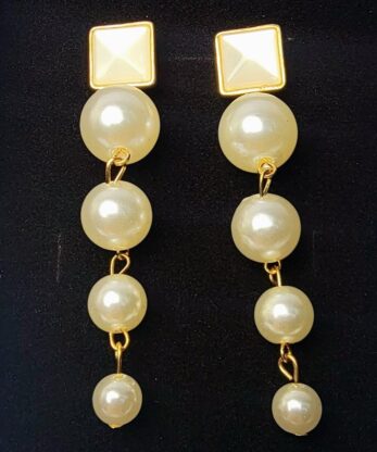 Upraise your style with our superb long pearl drop earrings, crafted with precision in Pakistan.